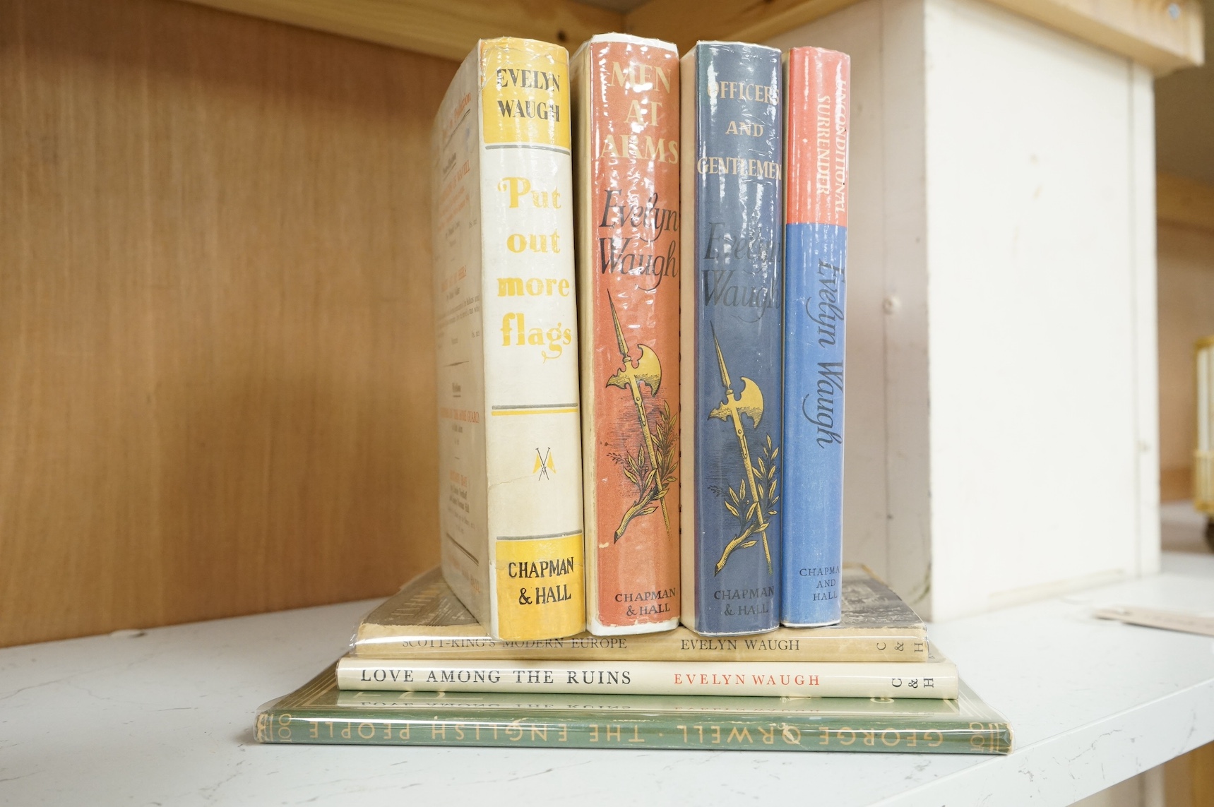 Six various Evelyn Waugh books and another by George Orwell to include Put Out More Flags, Men At Arms, Officers and Gentlemen, Unconditional Surrender, Scott-Kings Modern Europe, Love Among The Ruins and The English Peo
